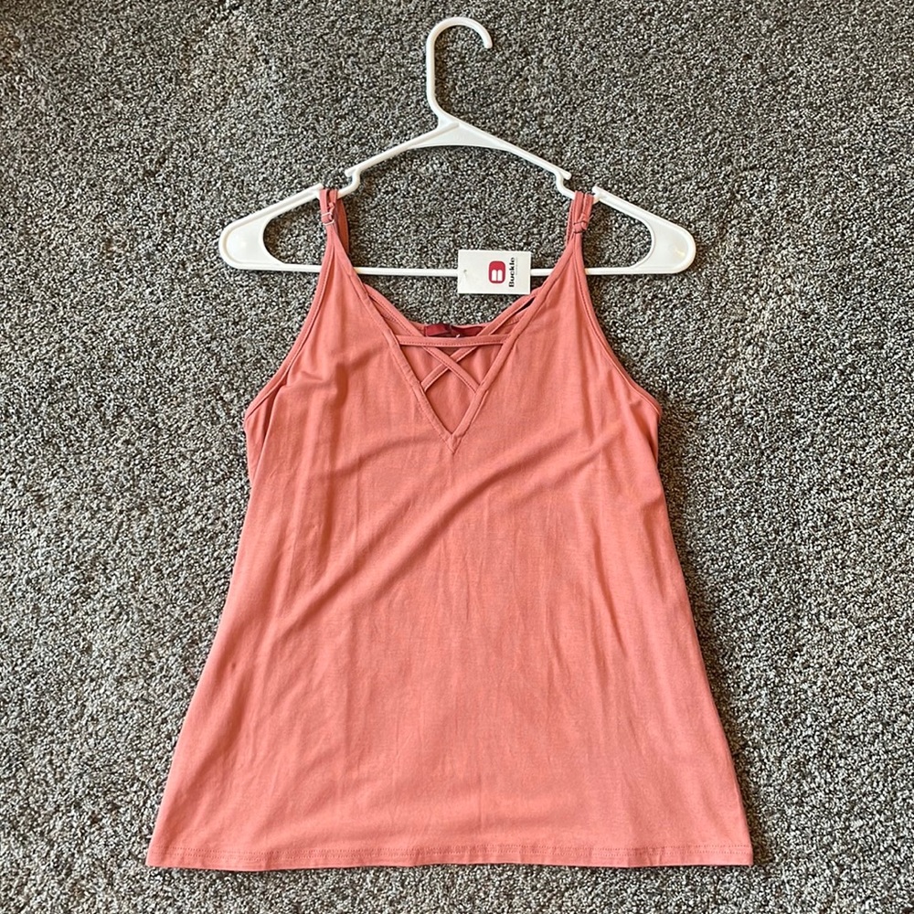 Women’s tank top. Cross cross v design in front. Women’s size xsmall.